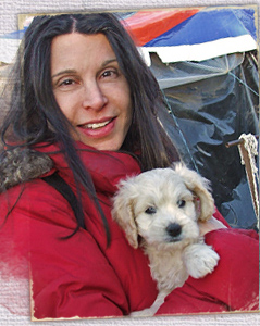 Kinship Circle responder Courtney Chandel brings food and first aid for animals with evacuees at a tent camp after the Chile earthquake tsunami