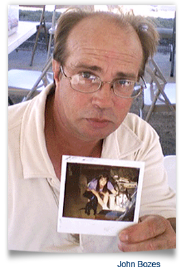 John Bozes holds Angel Girl and Bullet photo, family dogs shot dead in St Bernard school massacre 267x400
