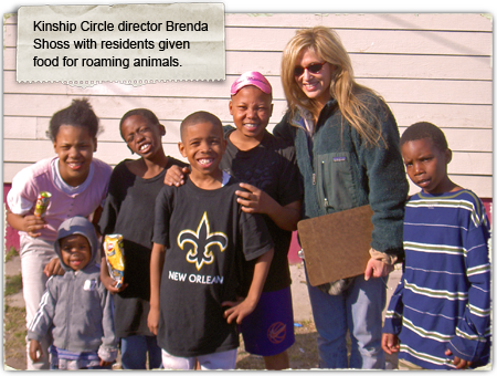 Brenda Shoss of Kinship Circle with NOLA residents given food to feed animals 450x330