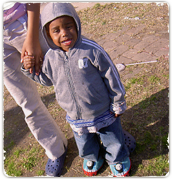 A little boy who lives in Upper 9th Ward West, post Katrina 250x260