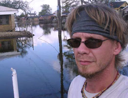 Tim Gorski surveys flooded Lower 9th Ward, searching for trapped, abandoned animals after Katrina 262x200