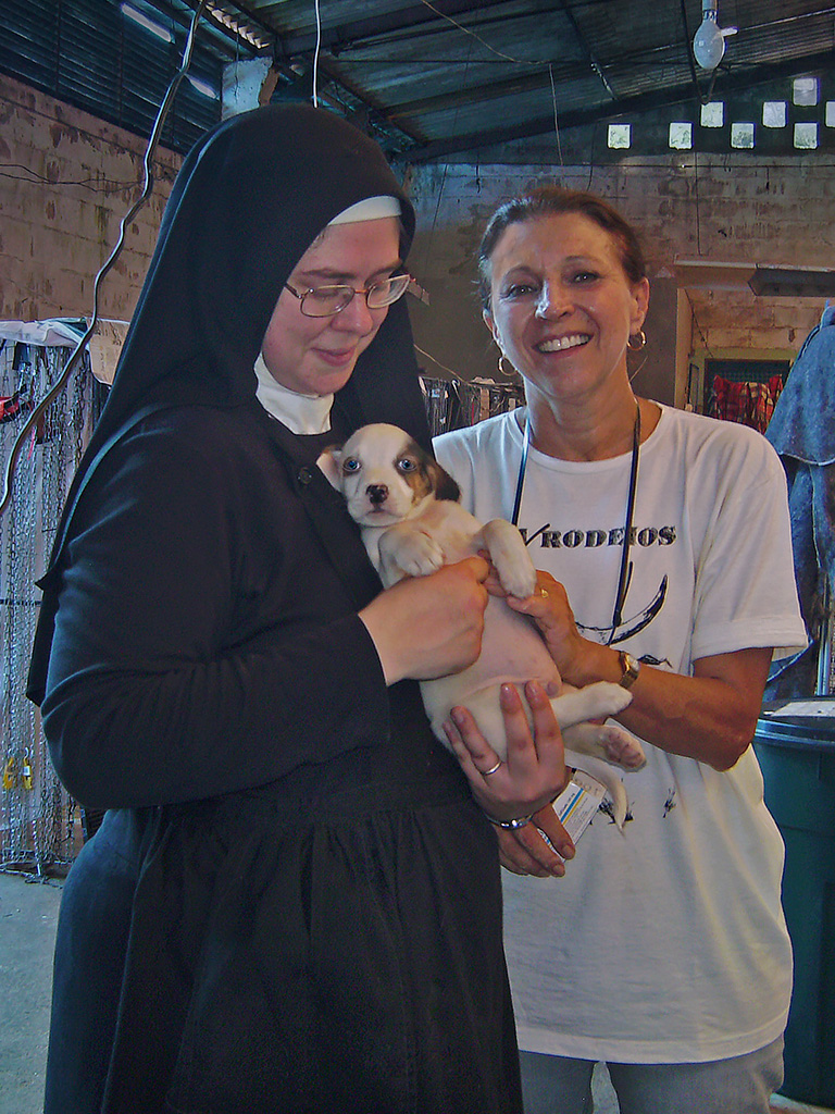 Sister Michael helps Bebete Filipi administer antibiotics, antacids, anti-emetics, Capstar...at the Teresopolis disaster shelter. (c) Kinship Circle, Brazil Mudslides