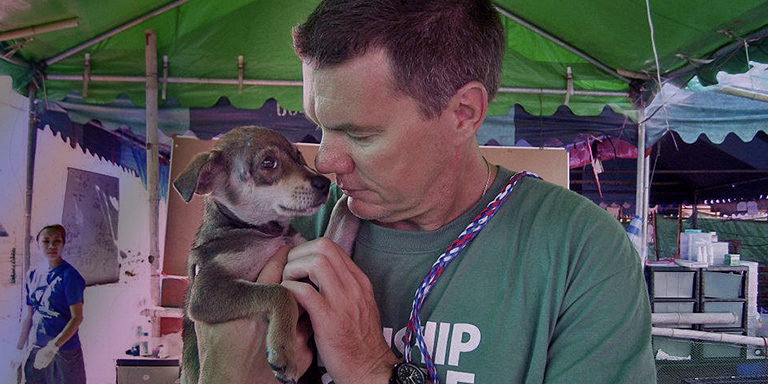 Ron Presley holds flood pup, (c) Kinship Circle