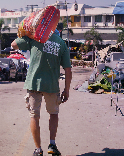 Ron Presley brings food to animals (c) Kinship Circle