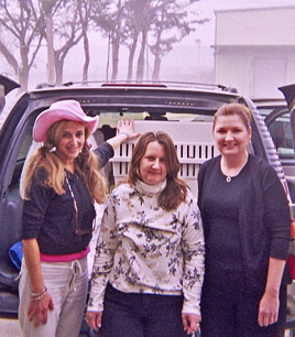 Brenda Shoss, Kathy Sweeney and Ramona Billot load a Kinship Circle vehicle with carefully crated animals to transport for out state adoptions 268x306